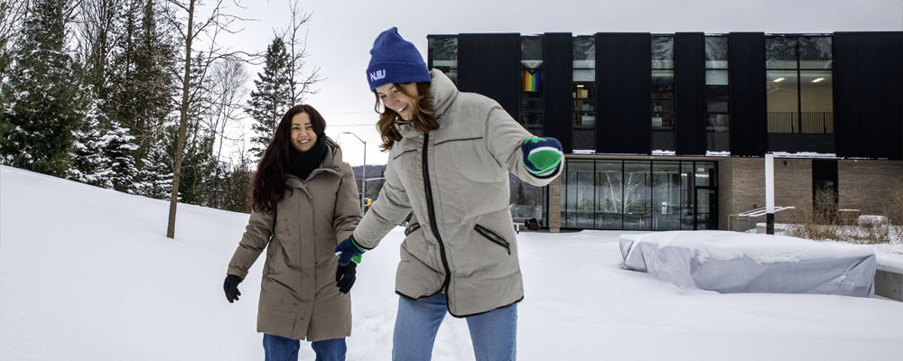 NUSU Student Centre and Students Snowshoeing