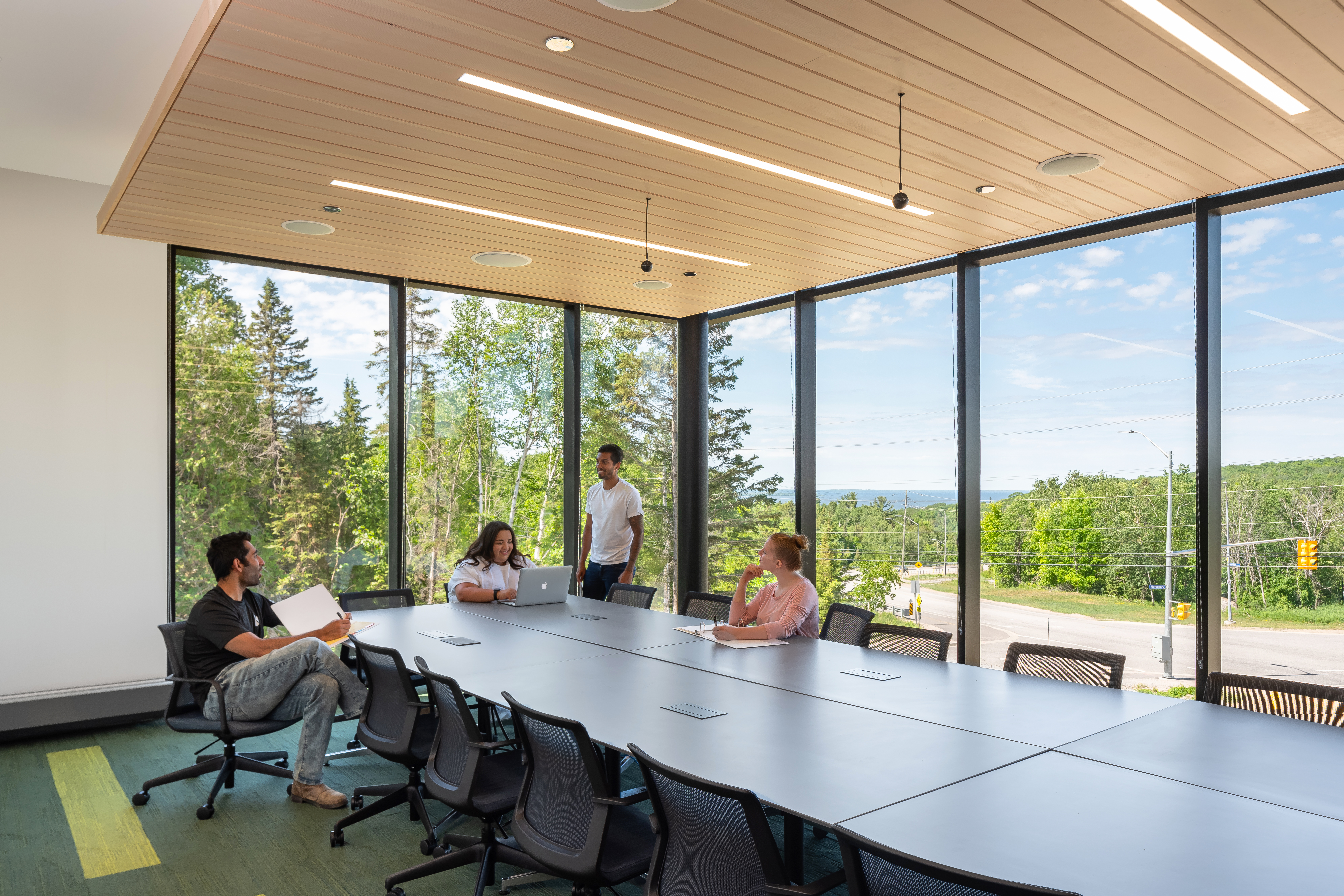 NUSU Student Centre Dr. Muriel Sawyer Boardroom with students meeting on a sunny day